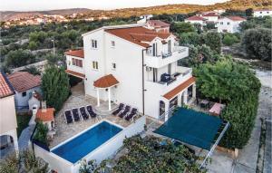 an aerial view of a house with a swimming pool at Seahorse Apartments in Ražanj