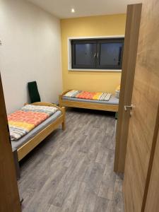 Postel nebo postele na pokoji v ubytování Ferienwohnung Zeitler