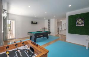 a living room with a pool table and a sink at Villa Manali in Jadranovo