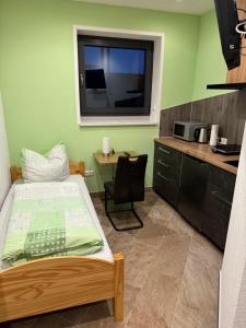 Kuchyň nebo kuchyňský kout v ubytování Ferienwohnung Zeitler