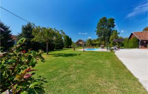 a park with a pool in the background at Pet Friendly Home In Gudovac With Wifi in Gudovac +26 photos