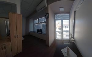 TV i/ili multimedijalni sistem u objektu Apartmani Kuzman