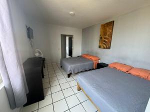 Postel nebo postele na pokoji v ubytování Hotel Urban Matamoros