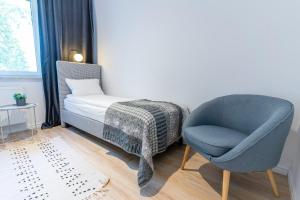Posteľ alebo postele v izbe v ubytovaní River View - widok na wodę, parking w hali, winda, 3pok i 5 łóżek, klima, Netflix i Max, centrum