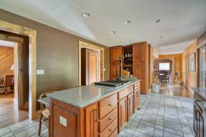a kitchen with a large island in a room at Highland Farms - Your Private Forest Farm in Brightwood