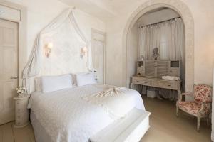 Ein Bett oder Betten in einem Zimmer der Unterkunft Villa Caprichosa Boutique Hotels