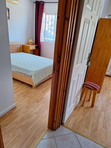 Postel nebo postele na pokoji v ubytování Luzia Quartos