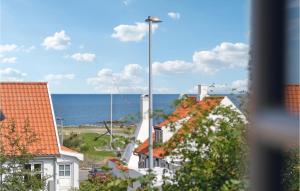a view of the ocean from a house at 2 Bedroom Lovely Home In Svaneke in Svaneke