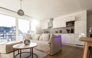 a living room with a couch and a table at Gebirgsresort Winterberg in Winterberg