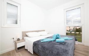 Posteľ alebo postele v izbe v ubytovaní Three-Bedroom Apartment In Trogir