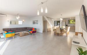 a living room with a couch and a table at Gorgeous Home In Brela in Brela