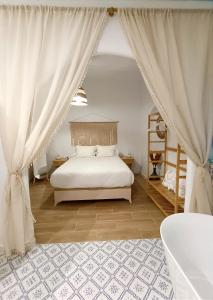 En eller flere senge i et værelse på Casa Medina