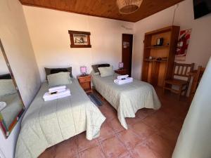 Postel nebo postele na pokoji v ubytování Hosteria Thiamalu