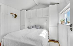 a white bedroom with a bed and a window at 3 Bedroom Cozy Home In Hejls in Hejls