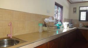 a kitchen with a sink and a counter top at Shine Day villa in Weligama +42 photos