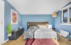 Ένα ή περισσότερα κρεβάτια σε δωμάτιο στο 4 Bedroom Lovely Home In Vejby