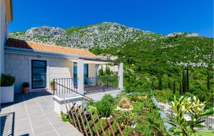 a house with a view of a mountain at Four-Bedroom Holiday Home In Zaton in Zaton
