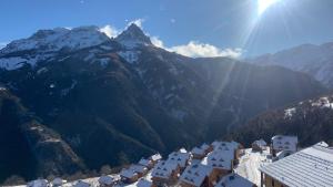 a view of a village in the mountains at Appartement Chalet Pra Loup in Uvernet-Fours