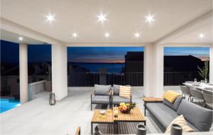 a patio with a couch and chairs and a table at Cozy Home In Makarska in Makarska