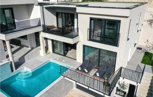 an aerial view of a house with a swimming pool at Cozy Home In Makarska in Makarska +58 photos