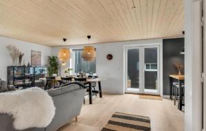 a living room with a couch and a table at Awesome Home In Slagelse With Kitchen in Slagelse