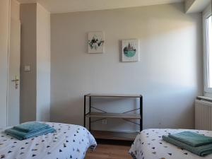 Rúm í herbergi á Le spitzacker gîte familial au calme