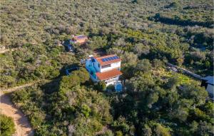 an aerial view of a house in the woods at Awesome Home In Nevidane With Wifi in Neviđane +25 photos