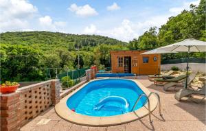 a swimming pool on a patio with a house at Beautiful Home In Ledenice With Sauna in Ledenice +18 photos
