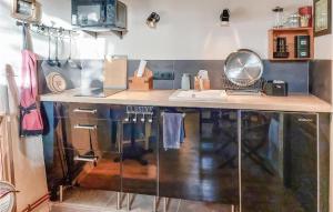 a kitchen with a counter and a counter top at 1 Bedroom Cozy Home In Plouézec in Plouézec