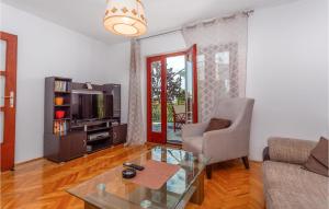 a living room with a couch and a coffee table at 4 Bedroom Pet Friendly Home In Malinska in Malinska