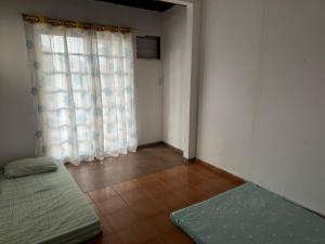 Postel nebo postele na pokoji v ubytování Casa em Angra dos reis