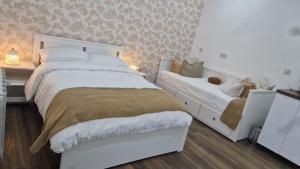Voodi või voodid majutusasutuse Aria House toas