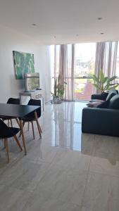 a living room with a couch and a table at Torre Charlotte in Posadas