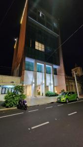 a motorcycle parked in front of a building at night at Torre Charlotte in Posadas