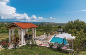 a house with a gazebo and a swimming pool at One-Bedroom Holiday Home In Danilo in Danilo Biranj +22 photos