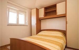 Postel nebo postele na pokoji v ubytování Apartment Stari Put V