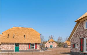 an old brick house with the number on it at Gorgeous Home In Den Ham With Sauna in Den Ham