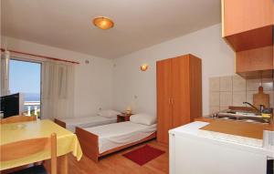 Ein Bett oder Betten in einem Zimmer der Unterkunft Apartment Prigradica V