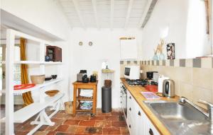 a white kitchen with a sink and a counter at Beautiful Home In Pech-Luna With Wi-Fi in Pech-Luna