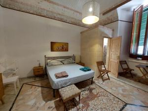 Ένα ή περισσότερα κρεβάτια σε δωμάτιο στο Lecce Centro Accommodation