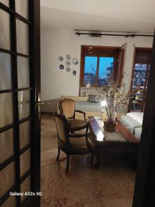 a living room with two chairs and a table at #Punto FM 6# in Marghera