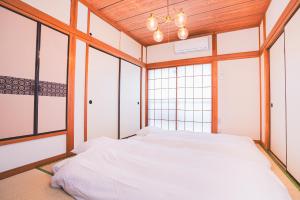 เตียงในห้องที่ New! Kamata close Haneda AP - Traditional & Hot Spring