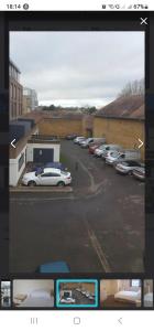 a view of a parking lot with cars parked at OYO The Watermans Arms Hersham in Hersham +45 photos