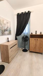 a room with a window with a black curtain at Casa Luna y Sol in Puerto del Rosario