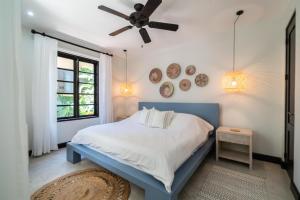 a bedroom with a bed and a ceiling fan at Calle La Ronda 18 At Las Catalinas in Playa Danta +31 photos