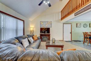 a living room with a couch and a table at The Gap at Poconos- Sun Room-Arcade- Game Room in Long Pond +35 photos