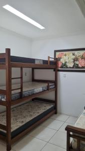 two sets of shelves in a room at Casa de praia na Reserva do Peró em Cabo Frio - familiar com piscina in Cabo Frio +121 photos