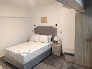 Postel nebo postele na pokoji v ubytování Aura Inn Hotel Cairo + 37 fotografií
