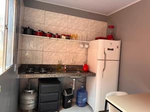 Dapur atau dapur kecil di Casa de 2 Quartos no Centro
