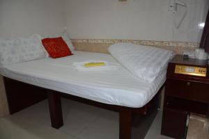 Un pat sau paturi într-o cameră la Everest Hostel